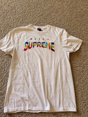 Reign Men’s White Short-Sleeve Tee with Multicolor 'SUPREME' Logo